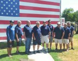 Posing for a photo are past and present firemen including Brahm Rossiter, Ted Schlosser, John Gibson, Norman Garcia, Don Steele, Kyle Reed, David Corbridge, Rick Borba and John Paz.